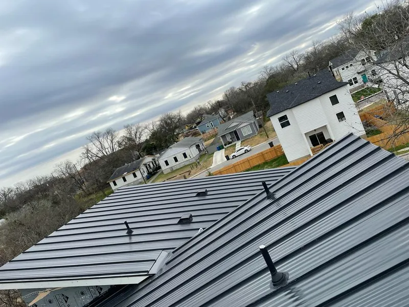 Standing seam metal roof panels with vents for Skylight Repair in Colleyville
